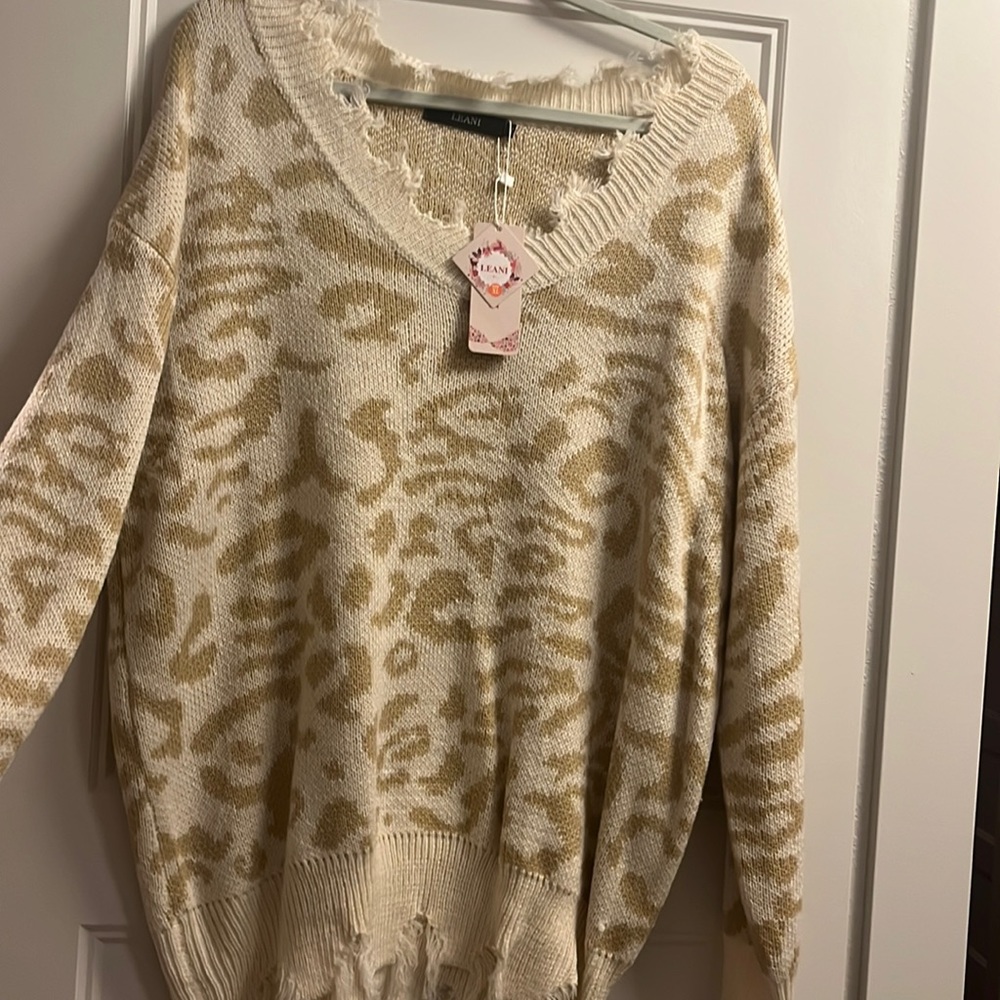 Distressed cream light leap off sweater